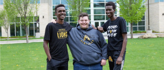 three students on campus